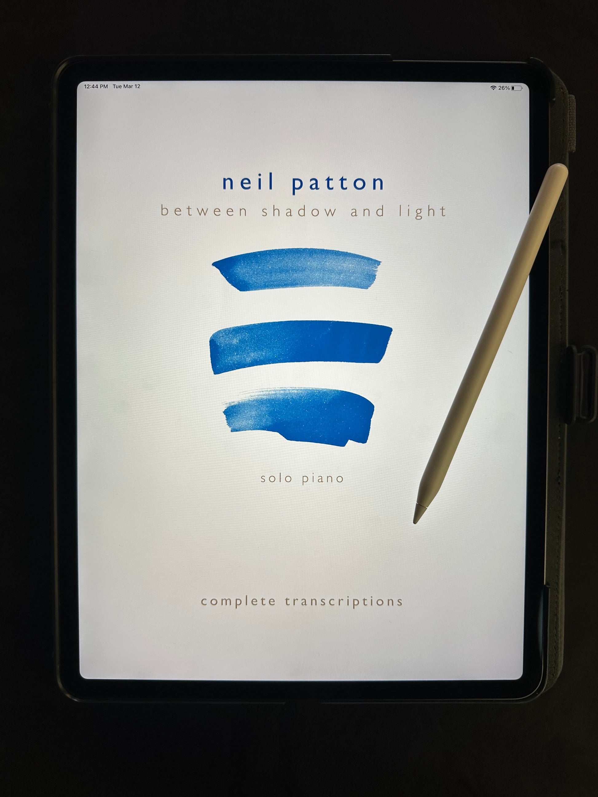 An iPad displaying the cover of Neil Patton's Between Shadow and Light Digital Songbook.