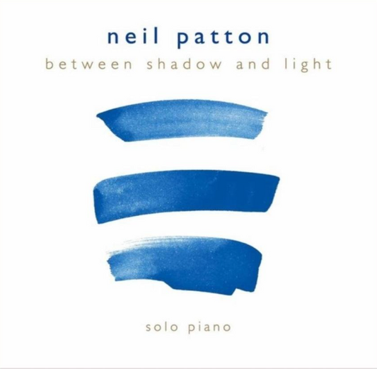 The text: Neil Patton, Solo Piano - Between Shadow and Light on a field of white and three bold painted blue horizontal brush strokes.