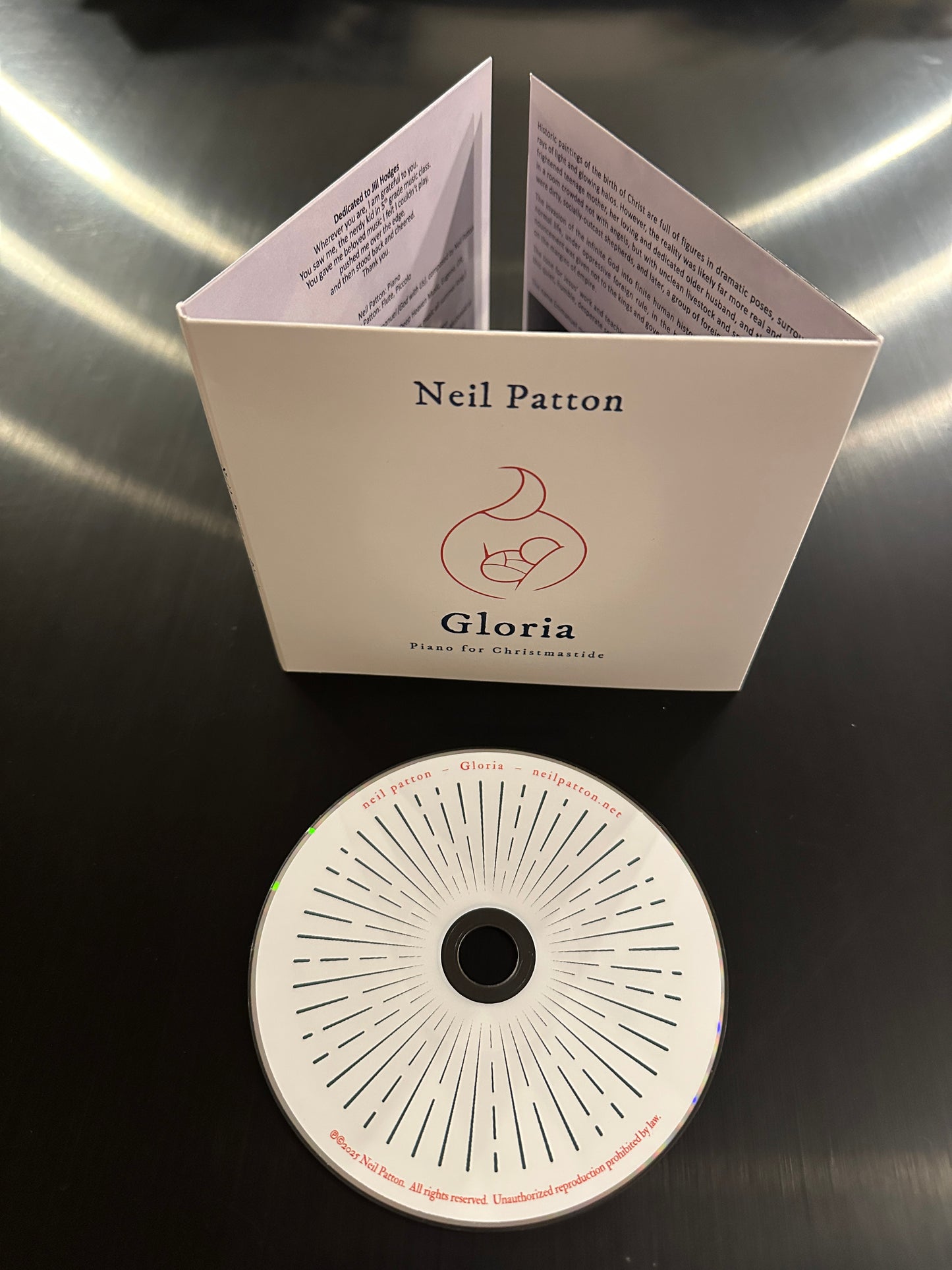 Product packaging with 'Neil Patton' branding on a reflective surface